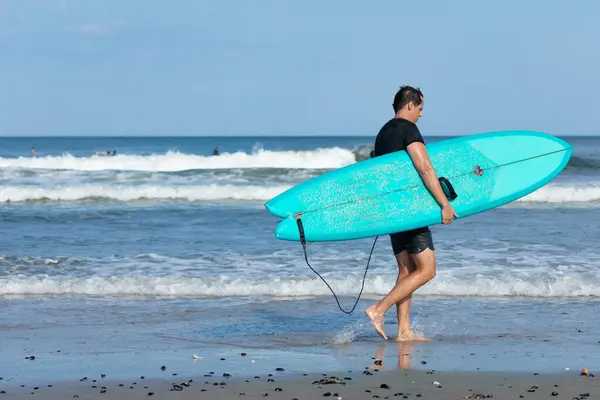 Stock image Deal, New Jersey - August 10, 2024: surfers surf the remnants of Hurricane Debby in the waters off Deal