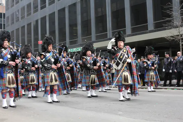 stock image New York, New York - March 17, 2012: Bagpipers from the Nassau County Police Emerald Society Pipe Band march in the annual St. Patrick's Day Parade.