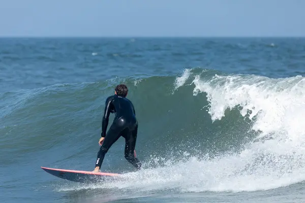 stock image Deal, New Jersey - August 18, 2024: Surfers crowd the water in Deal to surf the remnants of Hurricane Ernesto