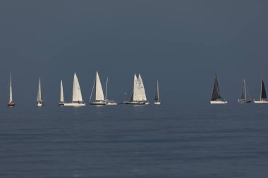 South Amboy, New Jersey - August 14, 2024: Sailabots race on the Raritan Bay between New Jersey and Staten Island during the beatufiul golden hour clipart