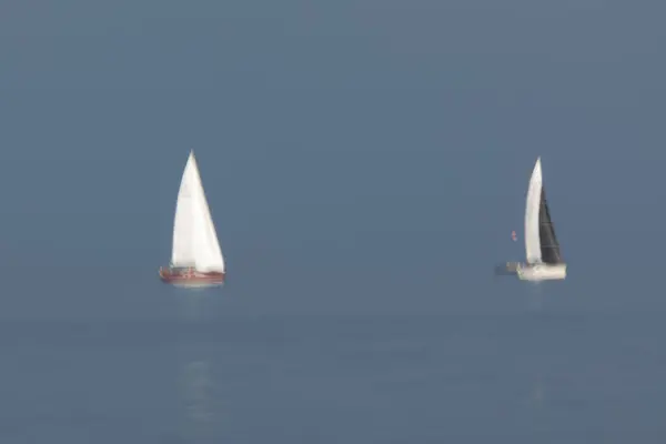 stock image Sailboats race across the Raritan Bay in the area between Staten Island and New Jersey on August 14, 2024. A long exposure was used to capture motion.