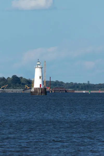 stock image South Amboy, New Jersey - August 21, 2024: A view of the Great Beds Lighthouse during golden hour on a beautiful summer's night