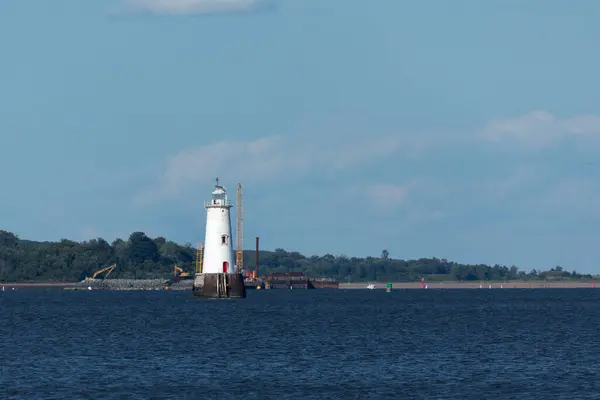 stock image South Amboy, New Jersey - August 21, 2024: A view of the Great Beds Lighthouse during golden hour on a beautiful summer's night