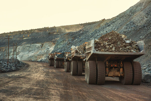 Heavy vehicles transport the iron ore
