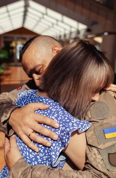 stock image Military kisses. Soldier kisses his girlfriend. Conceptual shot of joining an alliance. Girl stands near flag of Europe, and man near flag of Ukraine and they kiss. Symbolizing european integration