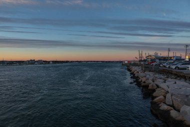 Inlet to Point Judith Pond, Rhode Island at sunset clipart