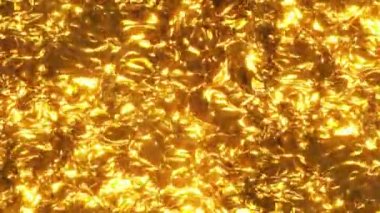 Shimmering oily liquid with a golden sheen. Abstract waves and ripples on the surface in liquid gold. Pulsations on the surface of golden liquid metal. Gold paint, oil, honey, lava, metal. Looped