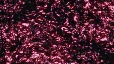 Shimmering oily liquid with a sheen. Abstract waves and ripples on the surface of liquid metal. Colorful ripples on the paint surface. Looped