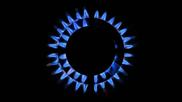 3D rendering of a kitchen burner glowing at night, close up. Natural gas concept. The gas stove is switched on by a lit burner
