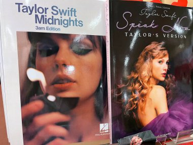 Sydney, Australia - March 05, 2024: Taylor Swift Midnights and Speak Now hardcover books presented for sale in a book store. clipart