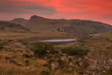 The majestic black lagoon in the snowy park where the Nevado del Ruiz, Nevado del Tolima and the Nevado Santa Isabel are located