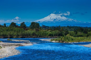 volcano osorno viewpoints blue water cabulco villarica chile volcan thaw river snow on top chile puerto varas puerto mont pucon villarica osorno blue water blue sky sunset