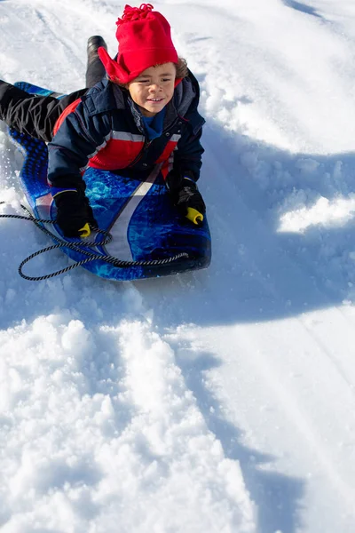 Mixed Race Preschool Boy Sled Slide Snow Covered Hill — Stock Photo, Image