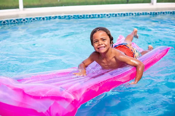 Smiling African American Little Boy Playing Swimming Pool Inflatable Raft — 스톡 사진