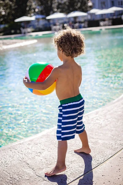 View Cute African American Little Boy Playing Pool Resort Colorful — Stok fotoğraf