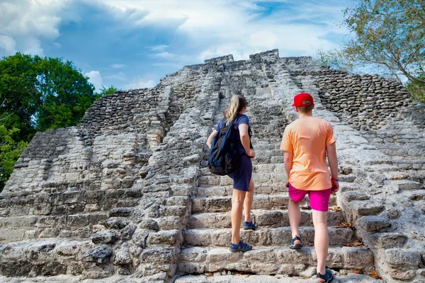 stock image woman and boy walking on Mayan tower stairs, Chacchoben Mayan ruins in Costa Maya Mexico