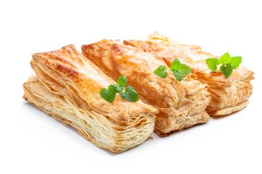 Puff  pastry cake slices isolated on white 