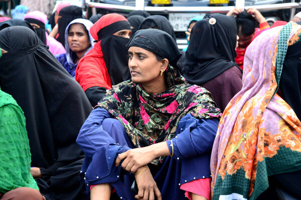 Olio Apparels Garment workers block a road as they protest to demand their unpaid wages and benefits in Dhaka, Bangladesh, on November 1, 2022.