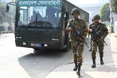 Bangladesh Army personnel stands guard at a makeshift camp at Bangabandhu Sheikh Mujib Medical University Medical Convention Center in Dhaka, Bangladesh, on January 3, 2024, to assist local administrations ahead of the upcoming general election on Ja