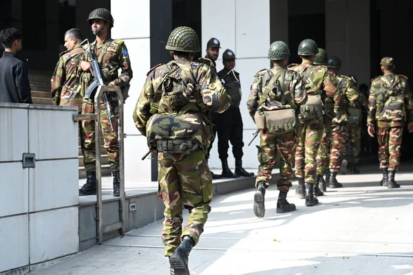 Bangladesh Army personnel stands guard at a makeshift camp at Bangabandhu Sheikh Mujib Medical University Medical Convention Center in Dhaka, Bangladesh, on January 3, 2024, to assist local administrations ahead of the upcoming general election on Ja