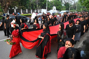 Members of the Prachyanat School of Acting and Design join the annual Lal Jatra procession and street performance to pay tribute to martyrs of the 1971 Bangladesh genocide, in Dhaka, Bangladesh, on March 25, 2023.  clipart