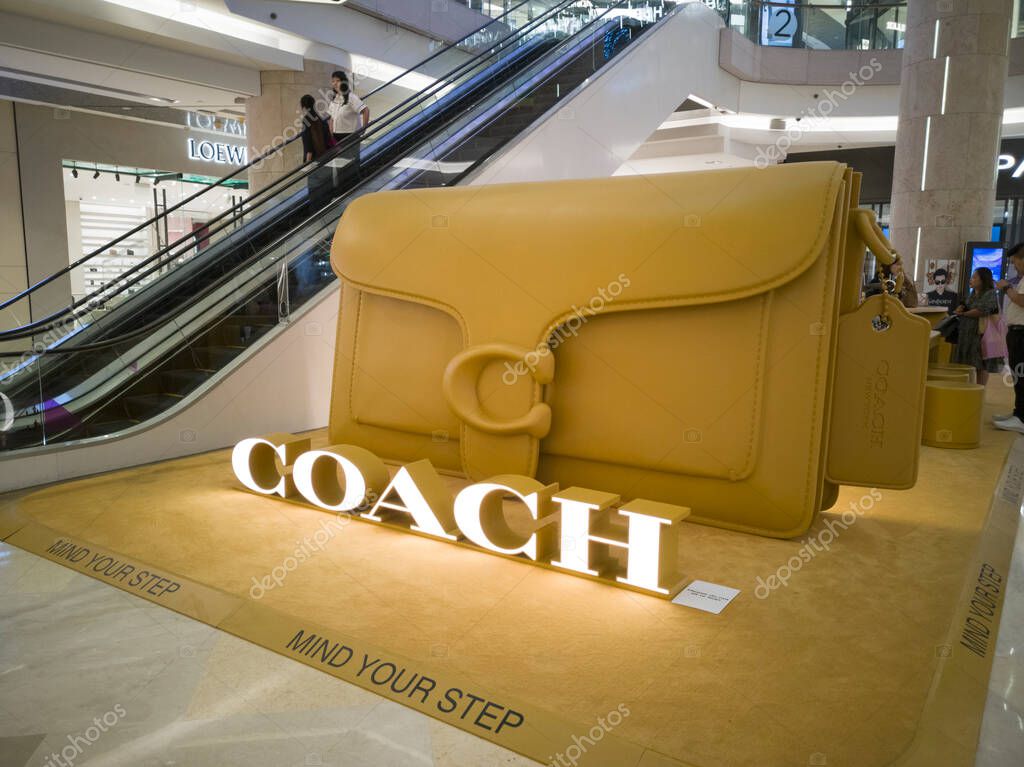 Singapore - March 20, 2025 : Coach life-size Tabby bag exhibit during spring campaign pop-up at ION Orchard mall. COACH is an American luxury leather goods company also manufacturing luggage and briefcases.