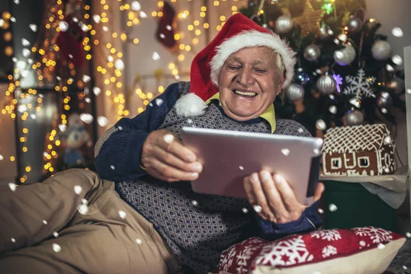 Portrait Grandfather Dressed Sweater Posing Cosy Room Christmas Tree Holding — Zdjęcie stockowe