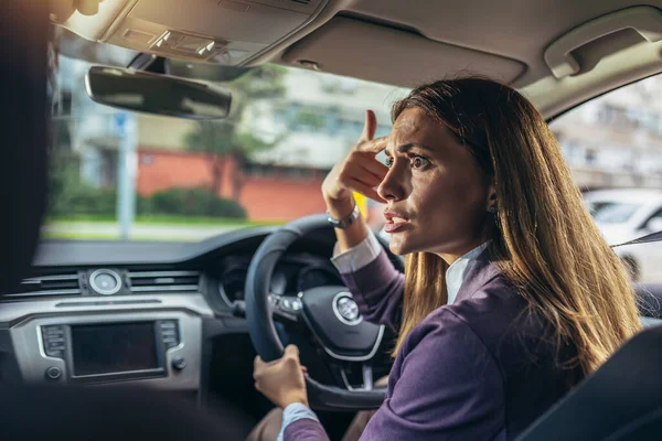 Angry young woman pissed off by drivers gesturing with hands