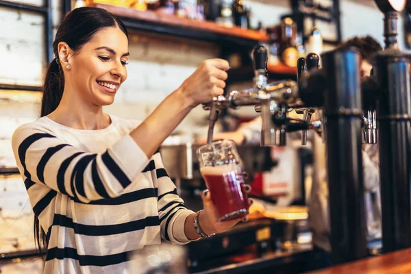 Female Bartender Tapping Beer Bar — Stock Photo, Image