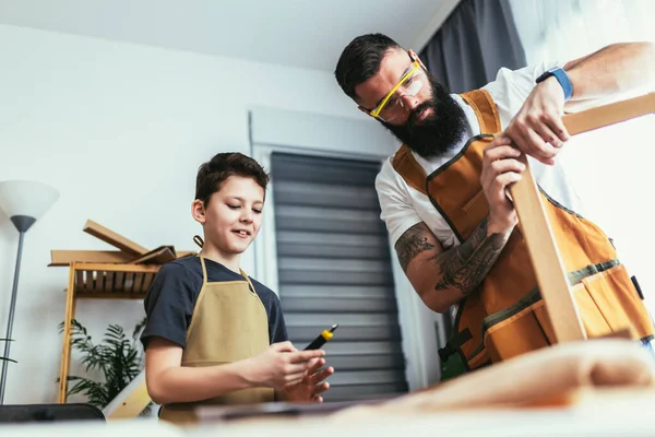 Father Son Making Furniture Wooden Plank Home — Stock Photo, Image