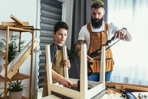 Smiling Father Teaching His Son Upholstery Home Having Fun — Stock Photo, Image