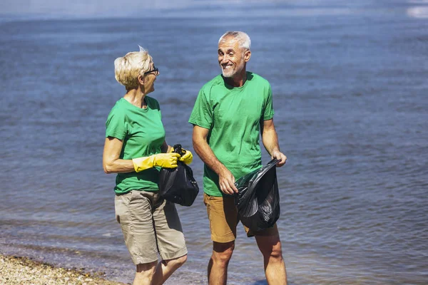Mature Volunteers Gathering Garbage Sea Coast Ecology Concept — Stok fotoğraf