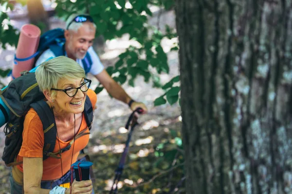 Mature Couple Hiking Forest Wearing Backpacks Hiking Poles Nordic Walking —  Fotos de Stock