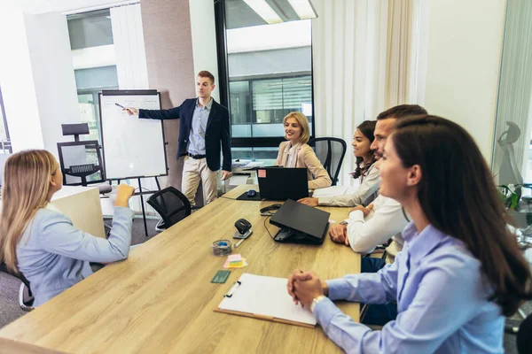 Young Businessman Giving Presentation His Colleagues Whiteboard Boardroom — Stock Photo, Image