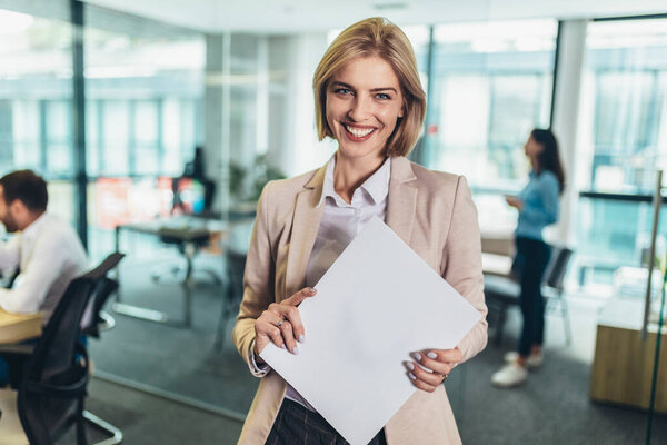 Shot of a confident young businesswoman standing in a modern office