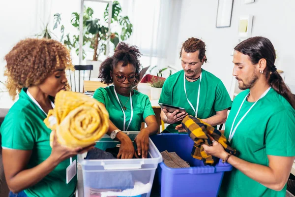 Volunteers Putting Clothes Donation Boxes Group Young Multicultural Volunteers Green — Stock Photo, Image