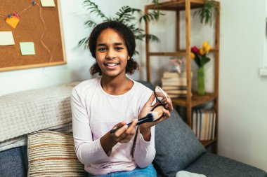 Teenager Girl Making A Video Blog On A Smartphone At Her Home. Beauty, makeup