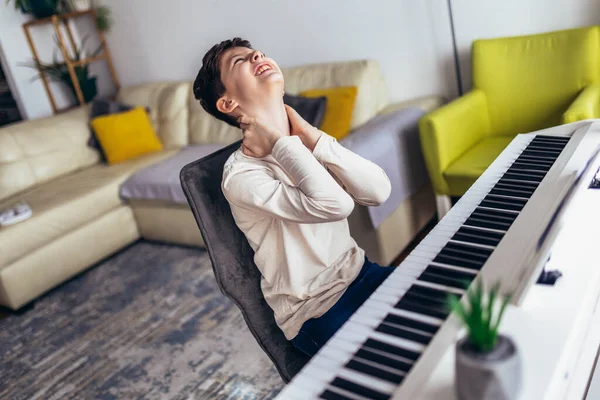 Little Boy Playing Piano Living Room Boy Suffering Neck Pain — Stockfoto