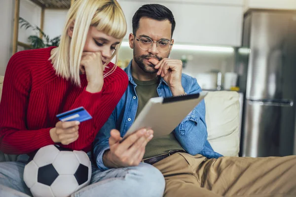 Young Couple Watching Football Game Digital Tablet Using Credit Card — Stock Photo, Image