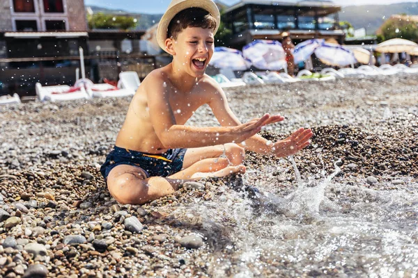 Boy Having Fun Beach Splashing Himself Water — 图库照片