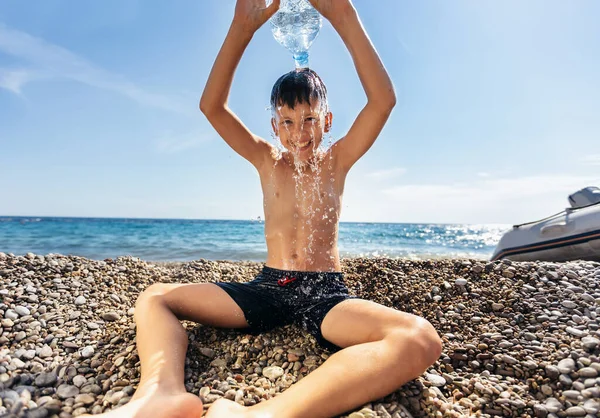 Boy Having Fun Beach Getting Splashed Water — Stockfoto