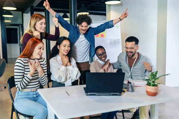 stock image Group of multiethnic business people working together in the office. Group of coworkers cheering in an office