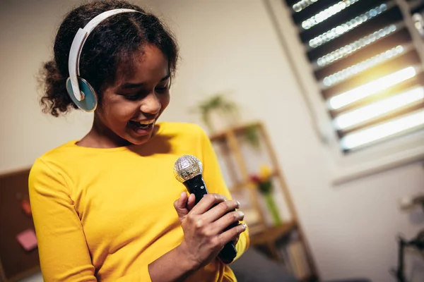 Cute Preteen Black Girl Holding Microphone Singing Karaoke Home Recording — Stock Photo, Image