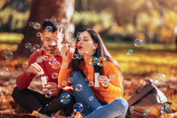 Couple Blowing Bubbles Having Fun Time Sunny Autumn Day Colorful — Stock Photo, Image