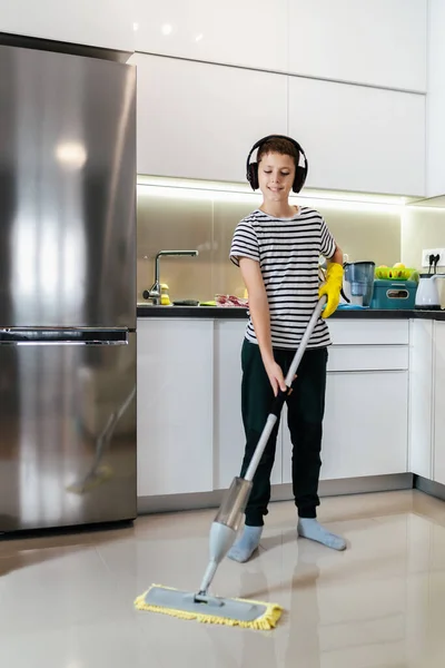 Male Kid Cleaning Floor Listening Music Doing His Chore Dancing — Stock Photo, Image