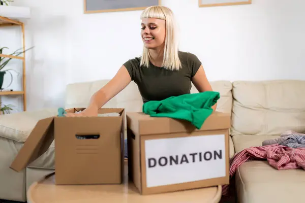 Young Blonde Woman Picking Out What Donate — Stock Photo, Image