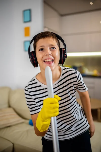 Male Kid Cleaning Floor Listening Music Doing His Chore Dancing — Stock Photo, Image