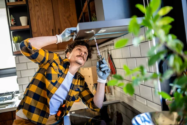 Latino Man Fixing Aspirator Kitchen — Stock Photo, Image