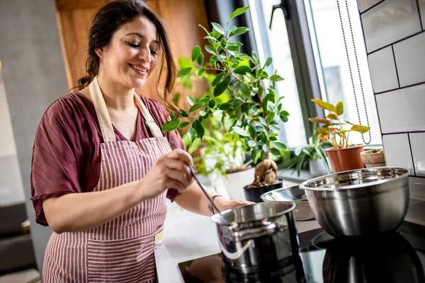 Latino Woman Cooking Her Modern Kitchen Stirring Pot Making Food — Stock Photo, Image