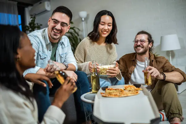 Multiracial group of friends having pizza party.